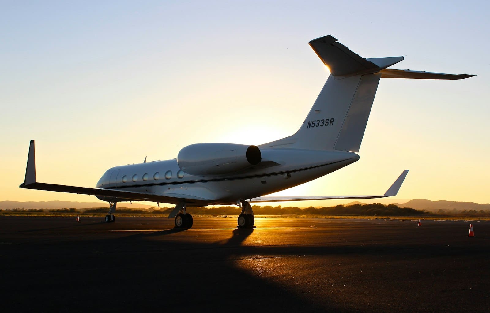 A regional aircraft on the tarmac at dusk